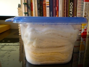 Stuff your washcloths in the container and voilà!  You have some handy homemade pre-soaked (inexpensive) baby wipes!